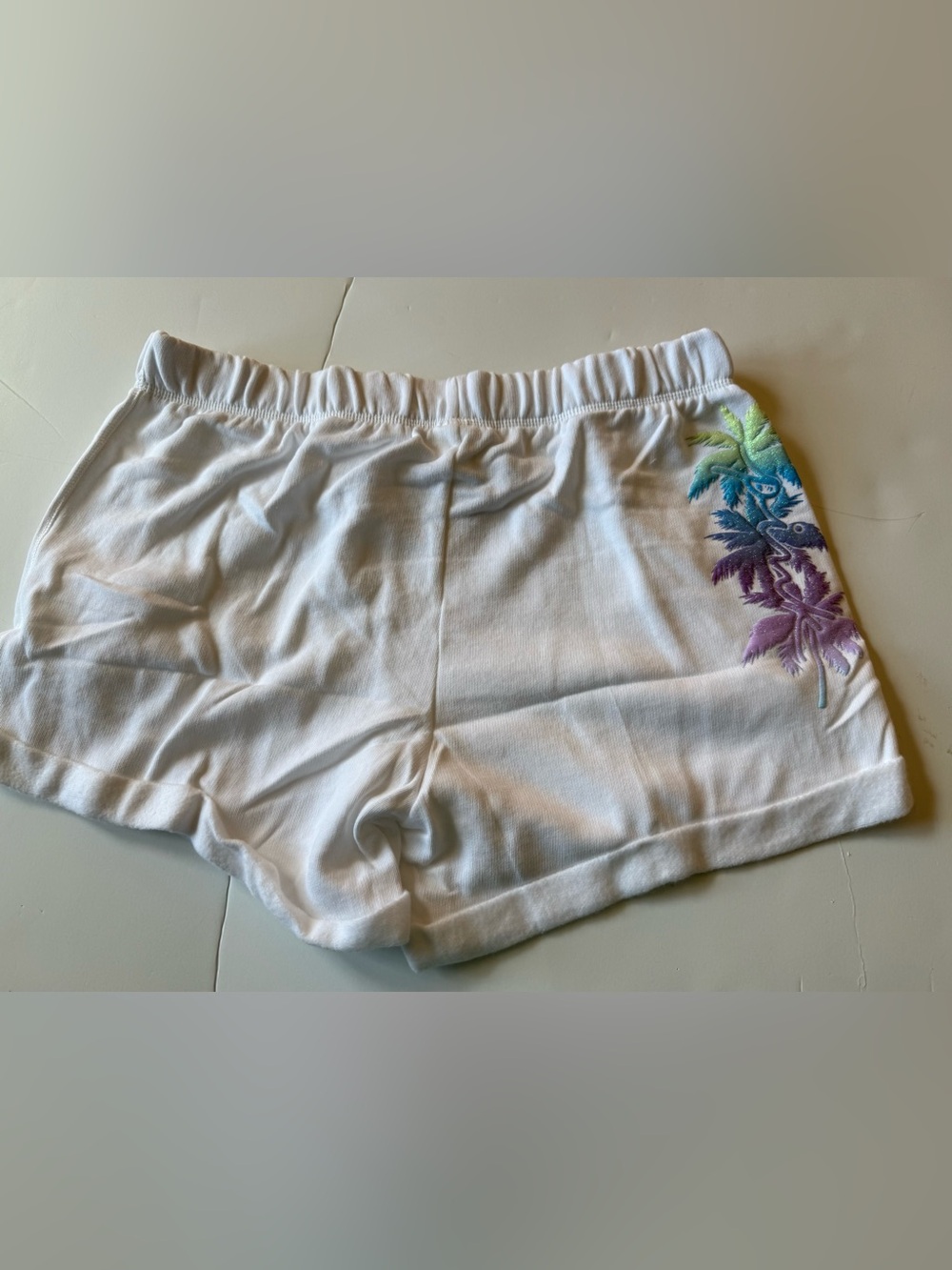 Victoria's Secret large shimmer palm tree shorts.